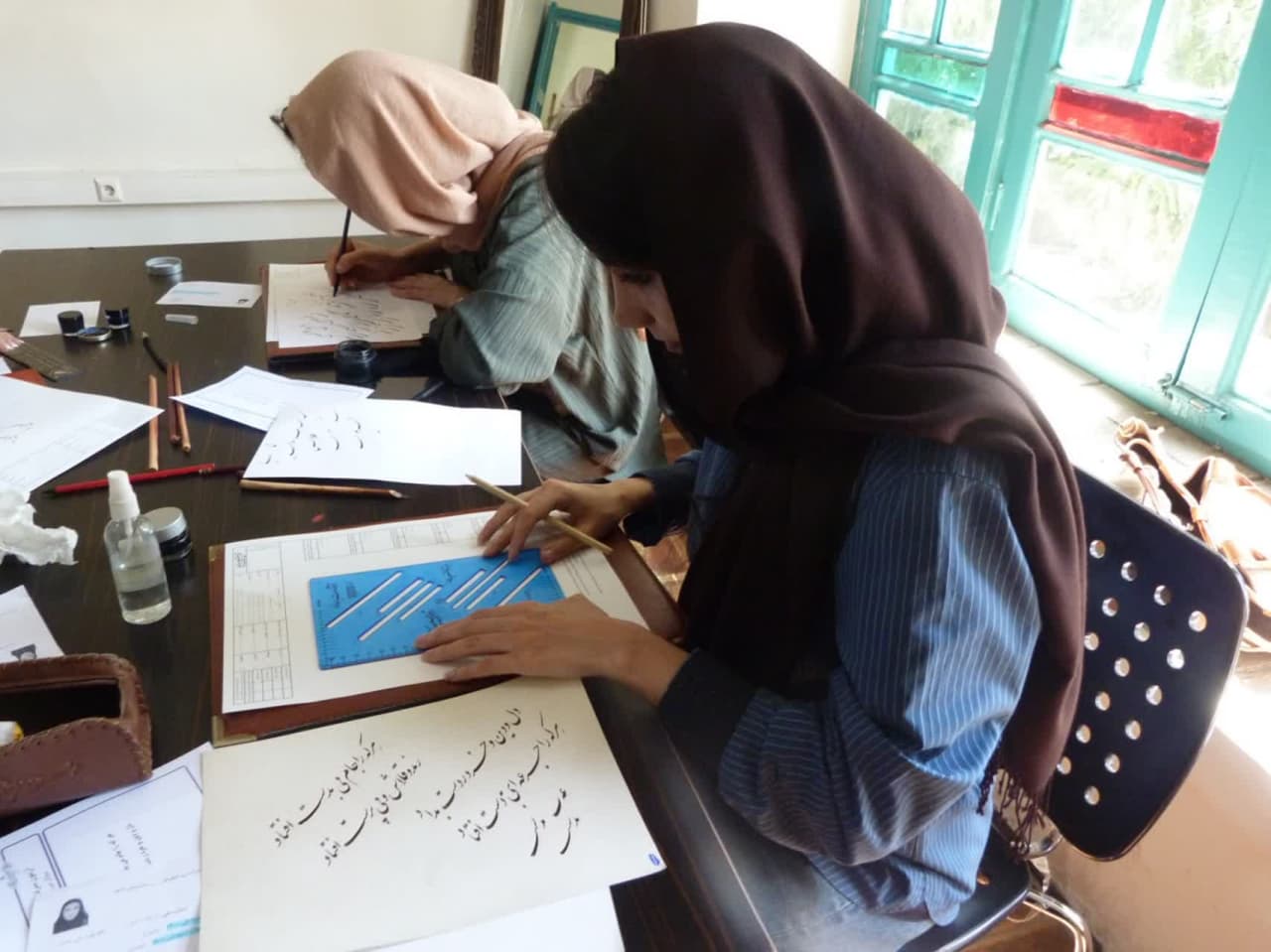 تصاویری از برگزاری آزمون خوشنویسی در کرج